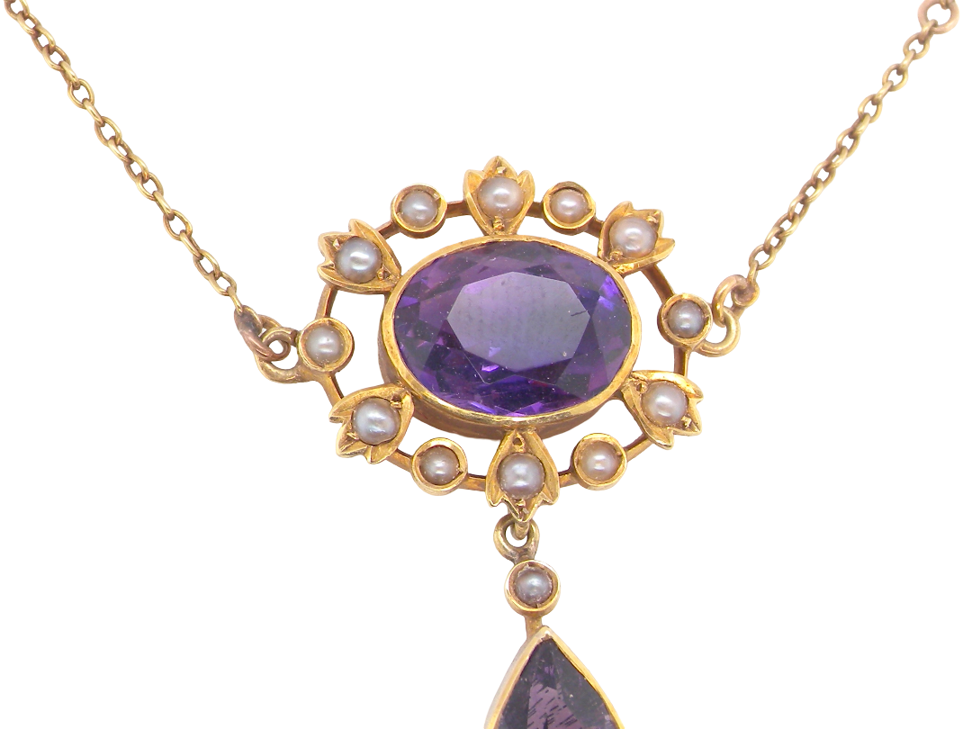 An elegant pendant from the late part of the 19th century. This Victorian pendant features two amethyst gemstones,