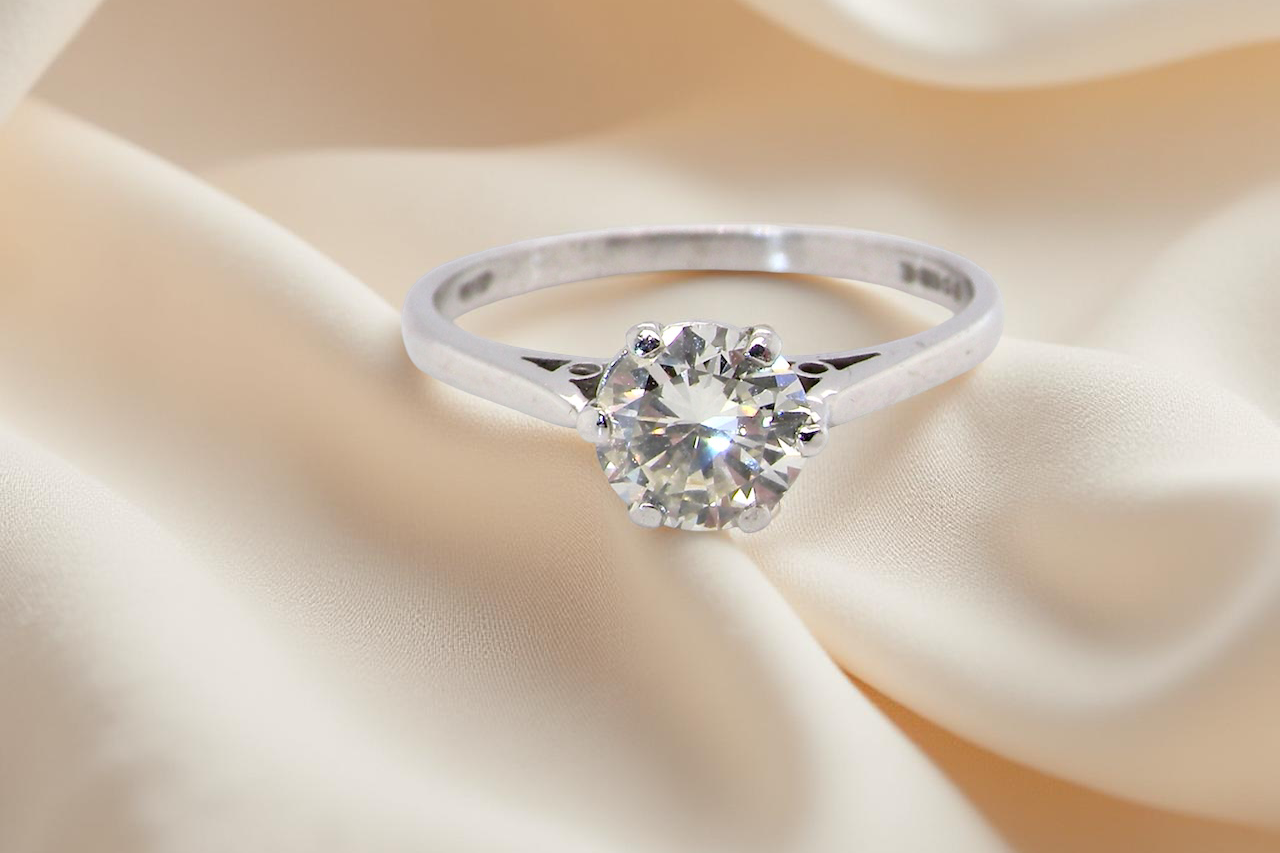 An elegant single-stone solitaire ring set with an exceptional brilliant-cut white diamond, estimated at 0.91 carats.