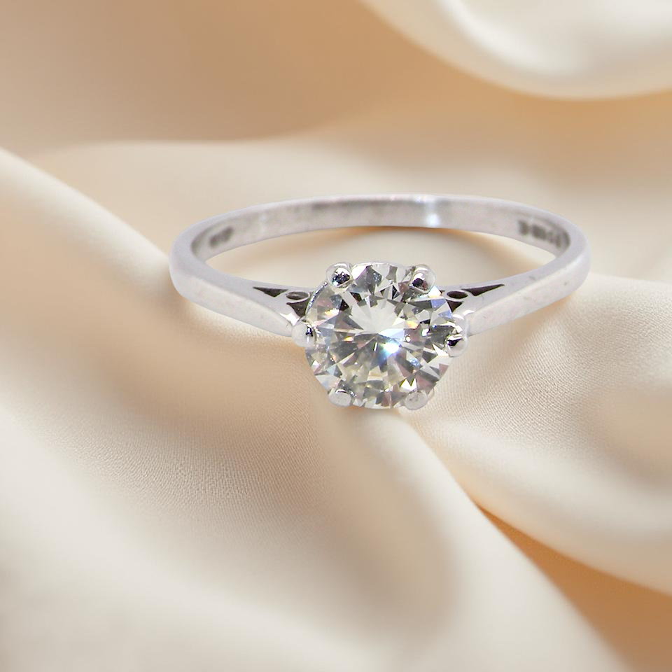 An elegant single-stone solitaire ring set with an exceptional brilliant-cut white diamond, estimated at 0.91 carats.