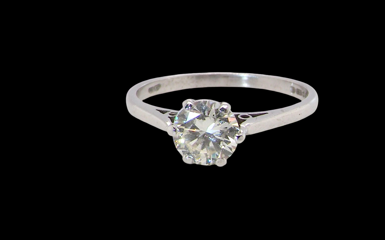 An elegant single-stone solitaire ring set with an exceptional brilliant-cut white diamond, estimated at 0.91 carats.
