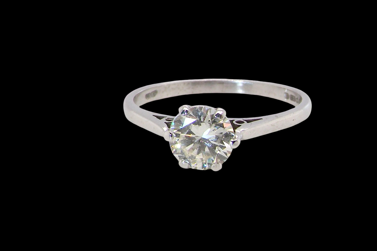 An elegant single-stone solitaire ring set with an exceptional brilliant-cut white diamond, estimated at 0.91 carats.