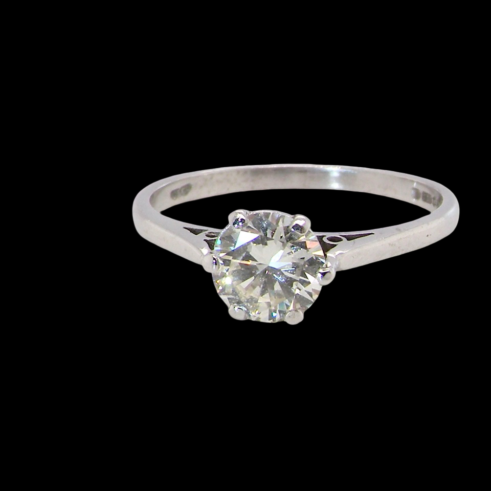 An elegant single-stone solitaire ring set with an exceptional brilliant-cut white diamond, estimated at 0.91 carats.