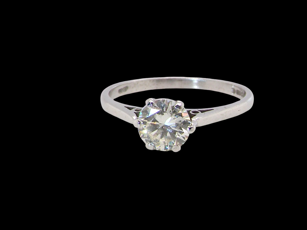 An elegant single-stone solitaire ring set with an exceptional brilliant-cut white diamond, estimated at 0.91 carats.
