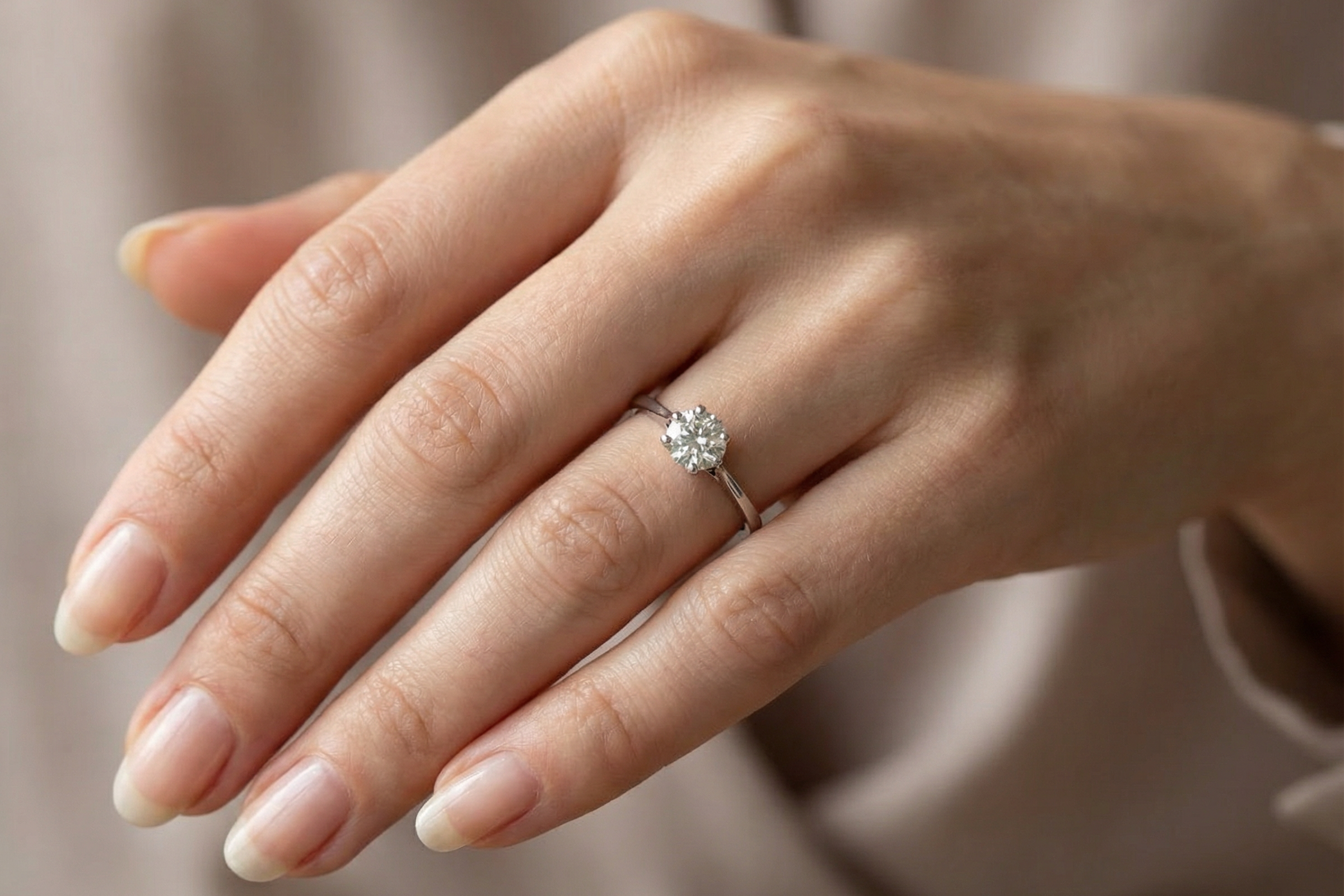 finger view An elegant single-stone solitaire ring set with an exceptional brilliant-cut white diamond, estimated at approximately 0.91 carats.