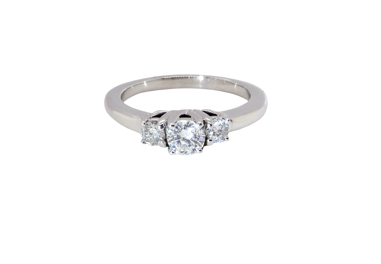 An elegant trilogy ring set with three brilliant-cut white diamonds,