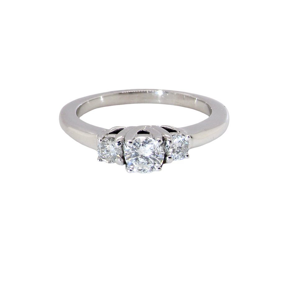An elegant trilogy ring set with three brilliant-cut white diamonds,