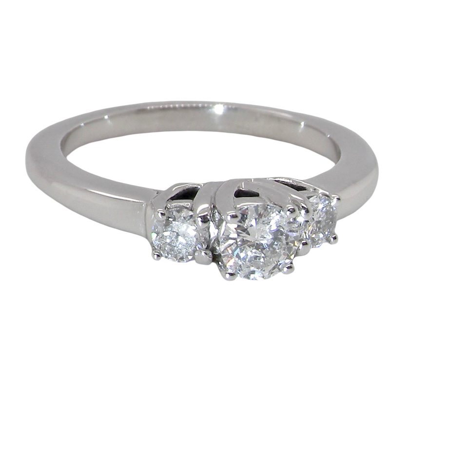 An elegant trilogy ring set with three brilliant-cut white diamonds, side