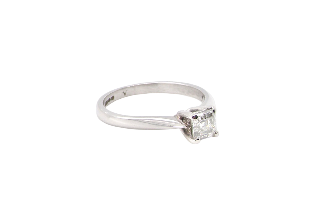 An emerald cut platinum solitaire Diamond Ring