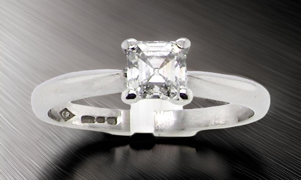 An emerald cut platinum solitaire Diamond Ring