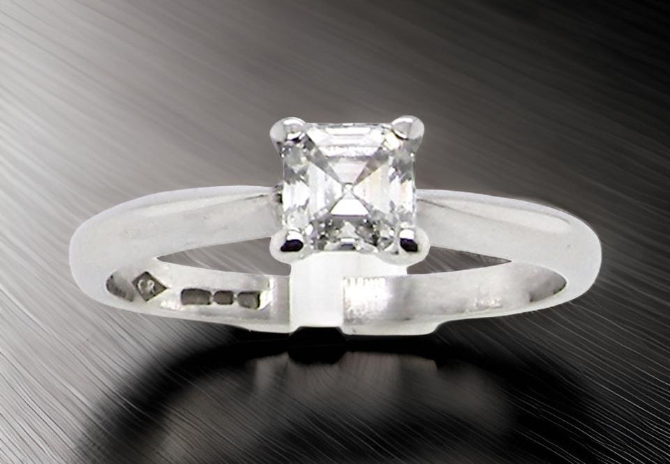 An emerald cut platinum solitaire Diamond Ring
