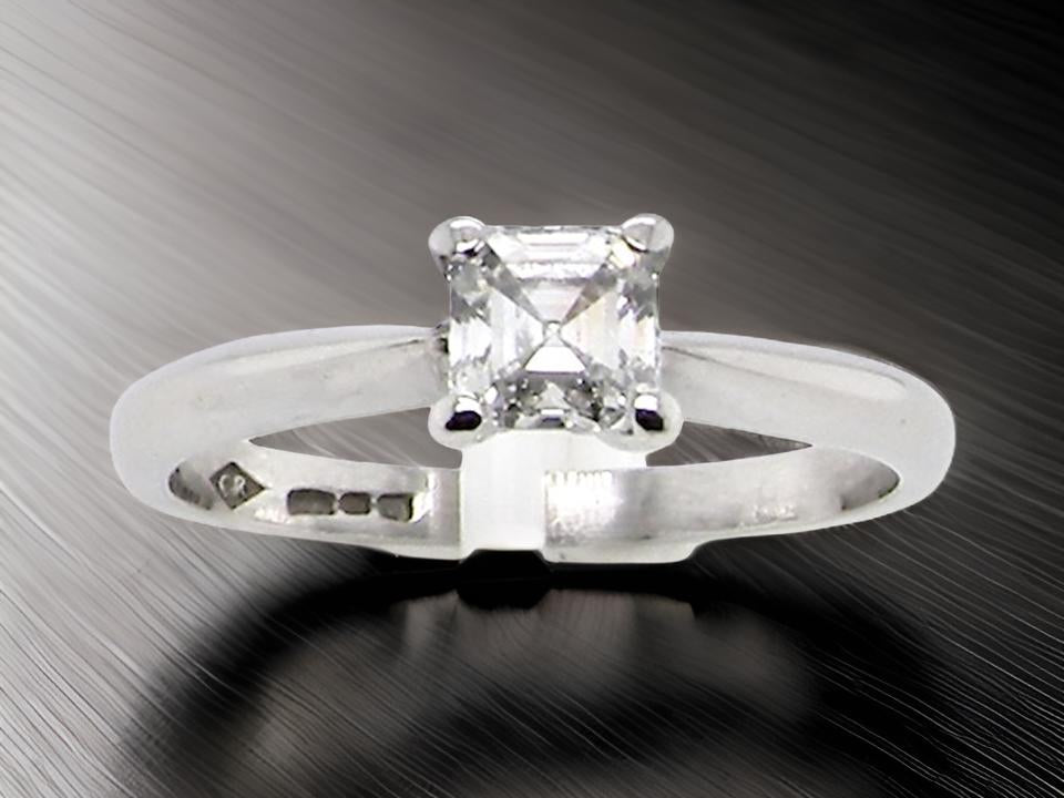 An emerald cut platinum solitaire Diamond Ring