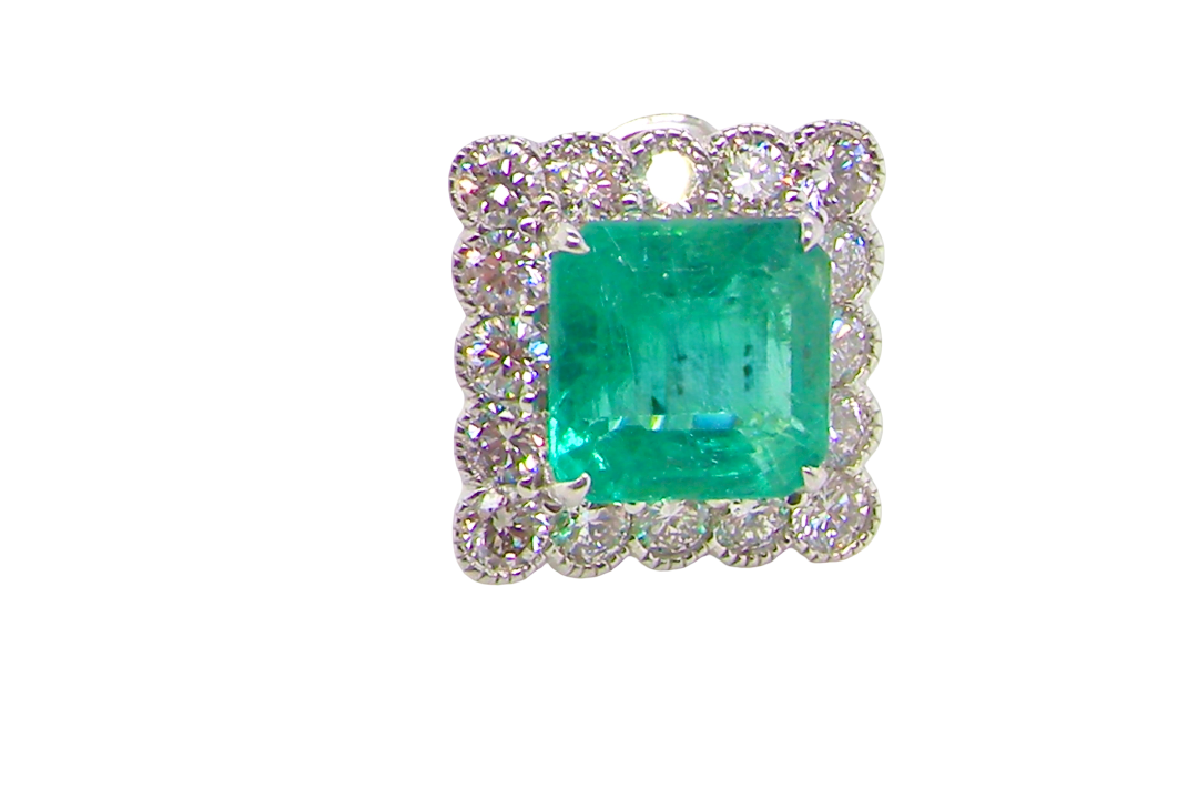 An exceptional pair of cluster earring Each of these beautiful earrings is set with a stunning square cut emerald, measures 7x7mm (est carat size 1.8 carats) excellent colour and clarity with just a few inclusions.