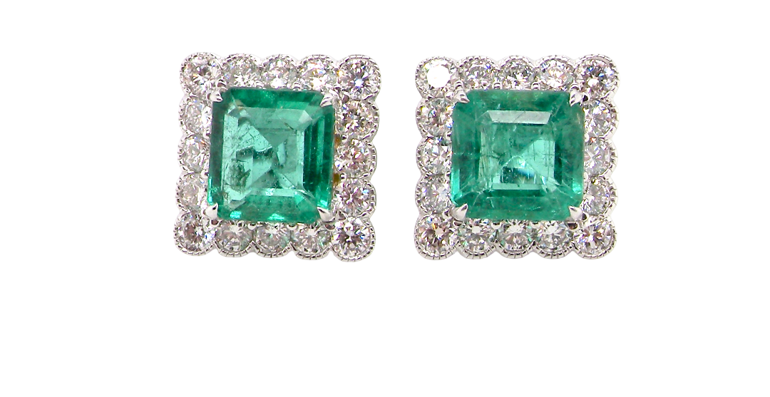 An exceptional pair of cluster earrings. Each of these beautiful earrings is set with a stunning square cut emerald, measures 7x7mm