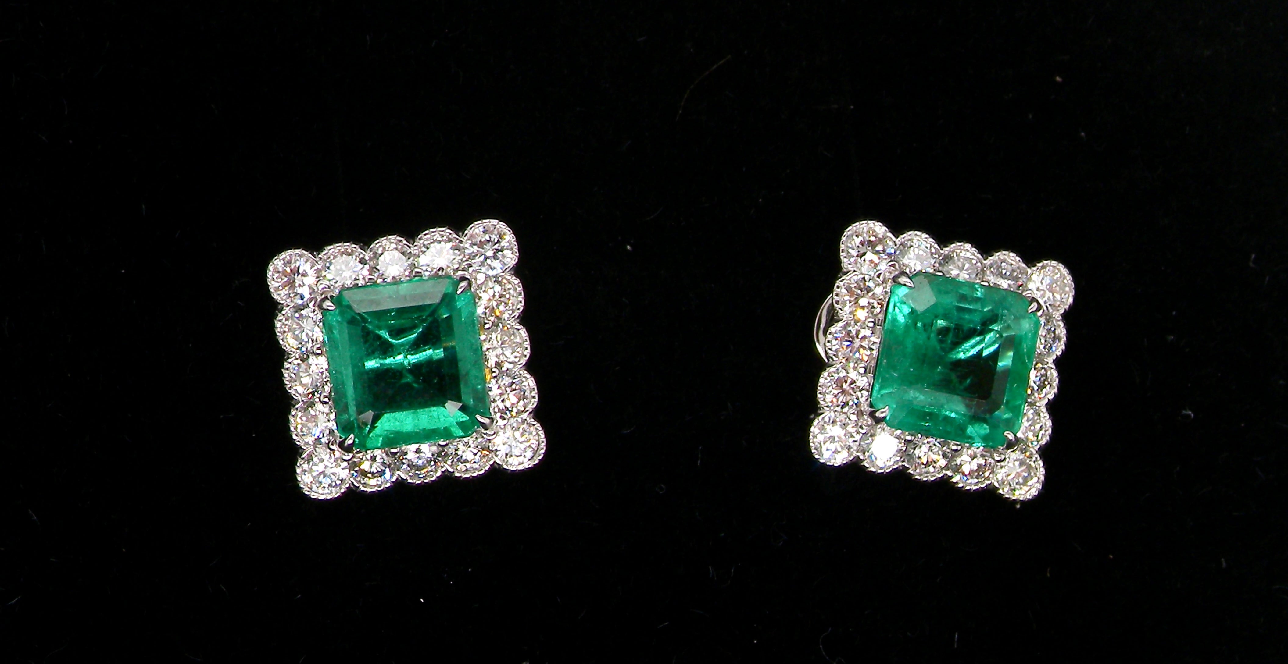 An exceptional pair of cluster earrings. Each of these beautiful earrings is set with a stunning square cut emerald, measures 7x7mm (est carat size 1.8 carats)