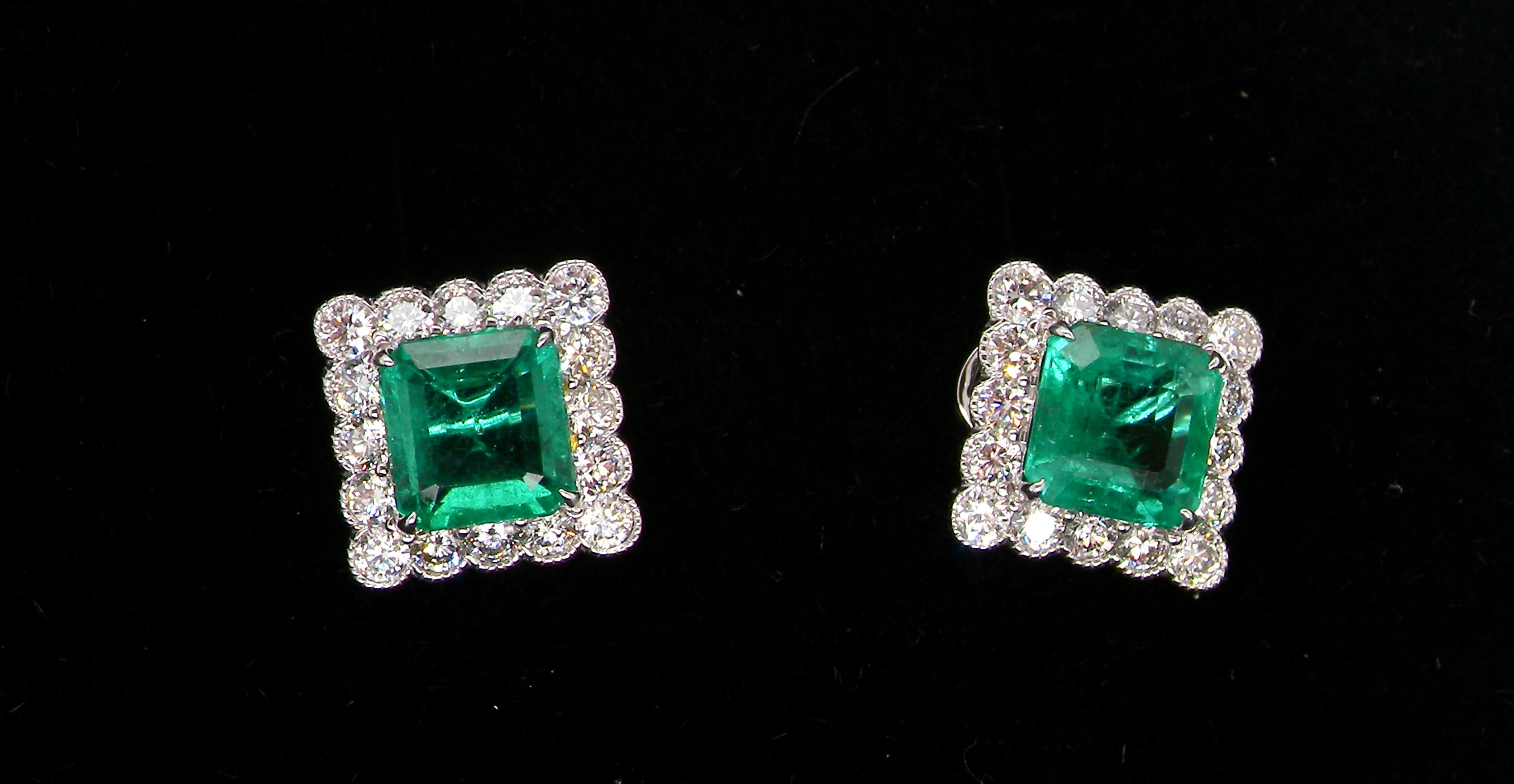An exceptional pair of cluster earrings. Each of these beautiful earrings is set with a stunning square cut emerald, measures 7x7mm (est carat size 1.8 carats)