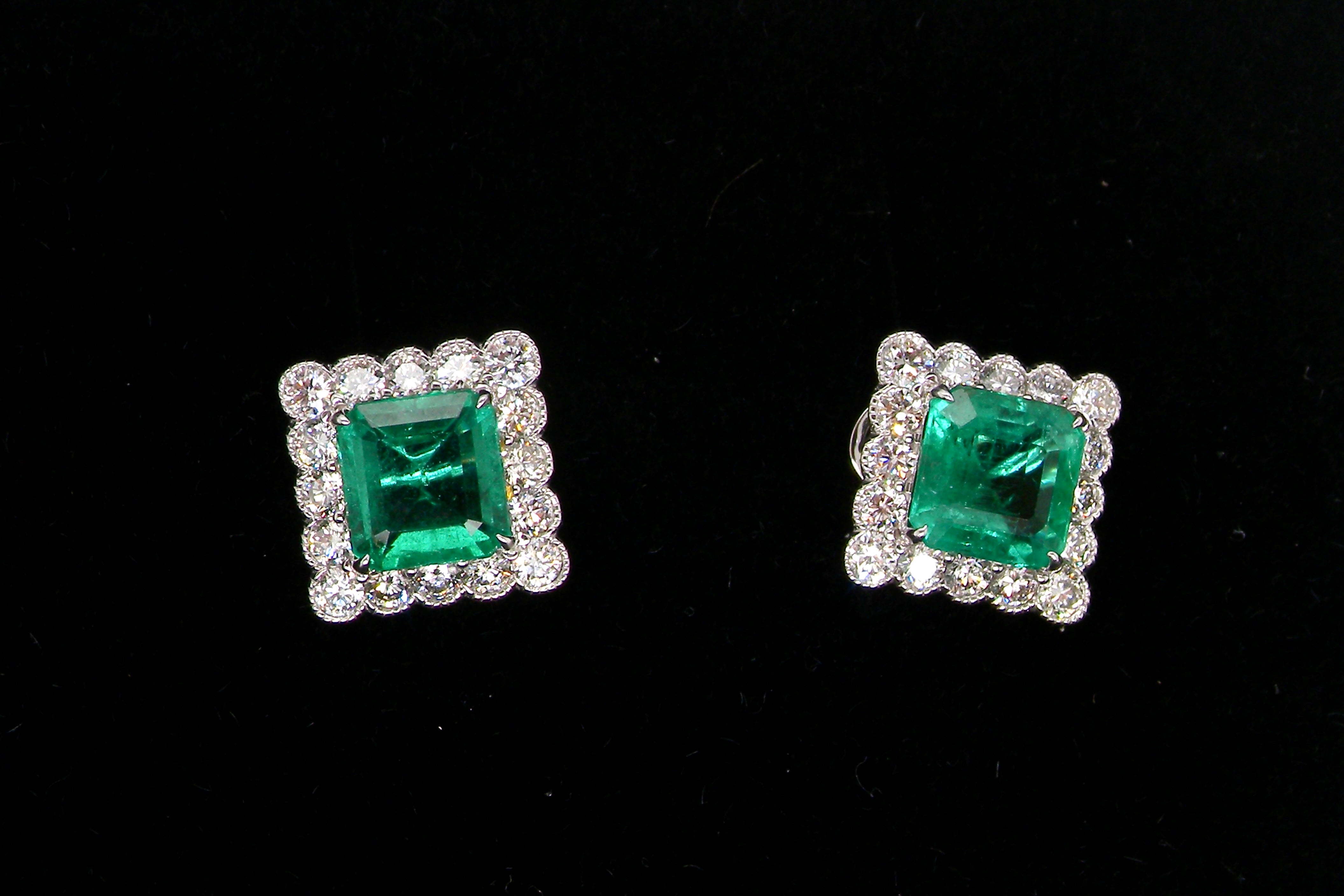 An exceptional pair of cluster earrings. Each of these beautiful earrings is set with a stunning square cut emerald, measures 7x7mm (est carat size 1.8 carats)