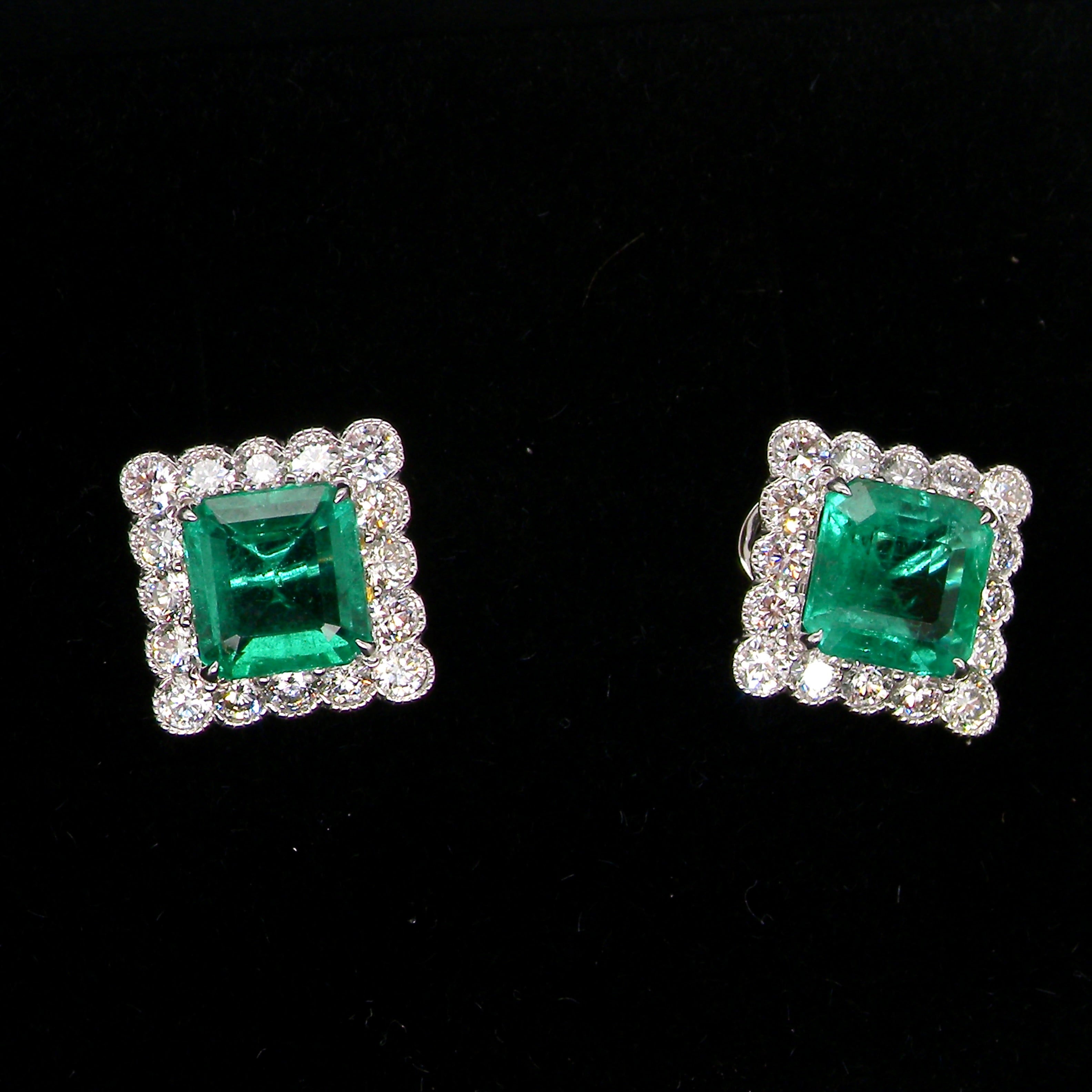 An exceptional pair of cluster earrings. Each of these beautiful earrings is set with a stunning square cut emerald, measures 7x7mm (est carat size 1.8 carats)