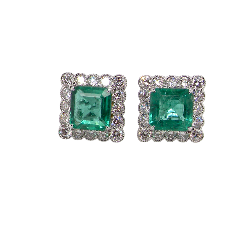An exceptional pair of cluster earrings. Each of these beautiful earrings is set with a stunning square cut emerald, measures 7x7mm (est carat size 1.8 carats) excellent colour