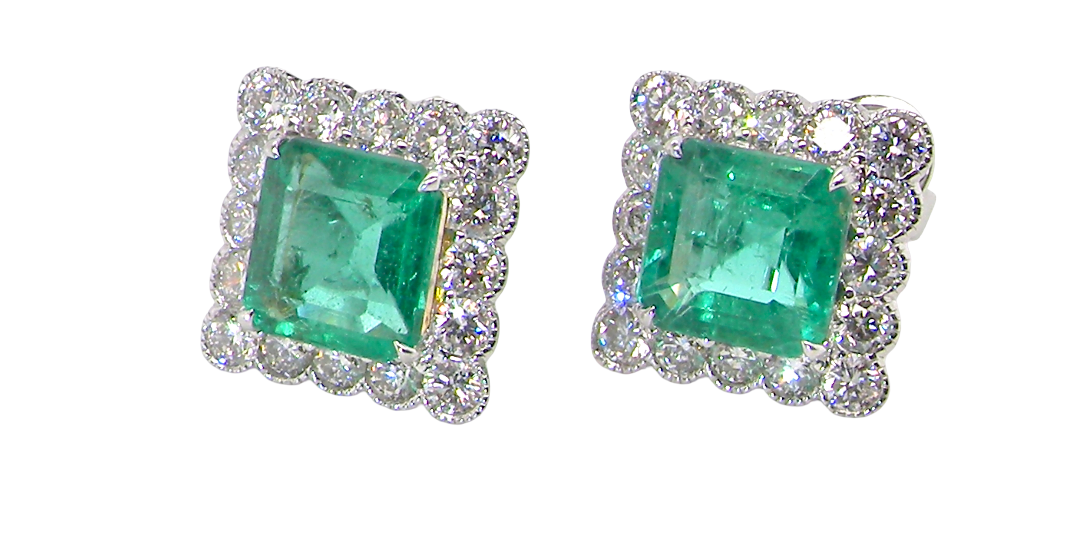 An exceptional pair of cluster earrings. Each of these beautiful earrings is set with a stunning square cut emerald, measures 7x7mm (est carat size 1.8 carats) excellent colour and clarity with