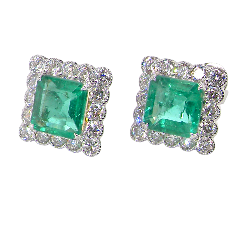 An exceptional pair of cluster earrings. Each of these beautiful earrings is set with a stunning square cut emerald, measures 7x7mm (est carat size 1.8 carats) excellent colour and clarity with