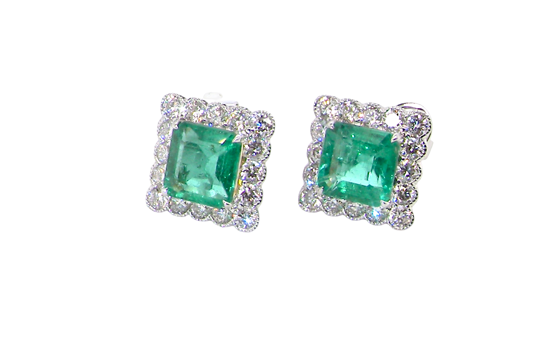 An exceptional pair of cluster earrings. Each of these beautiful earrings is set with a stunning square cut emerald, measures 7x7mm (est carat size 1.8 carats) excellent colour and clarity with just a few inclusions.