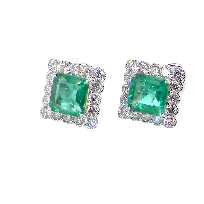 An exceptional pair of cluster earrings. Each of these beautiful earrings is set with a stunning square cut emerald, measures 7x7mm (est carat size 1.8 carats) excellent colour and clarity with just a few inclusions.