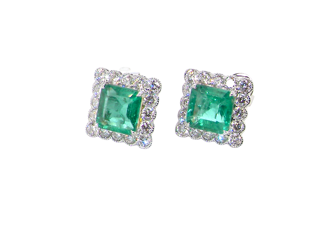 An exceptional pair of cluster earrings. Each of these beautiful earrings is set with a stunning square cut emerald, measures 7x7mm (est carat size 1.8 carats) excellent colour and clarity with just a few inclusions.