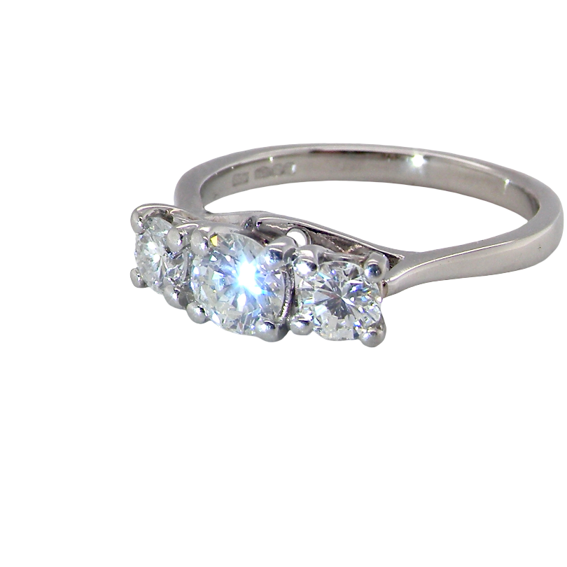 An exceptional three stone diamond trilogy ring, beautifully crafted in platinum and set with three brilliant cut white diamonds.