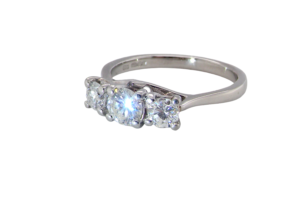 An exceptional three stone diamond trilogy ring, beautifully crafted in platinum and set with three brilliant cut white diamonds.