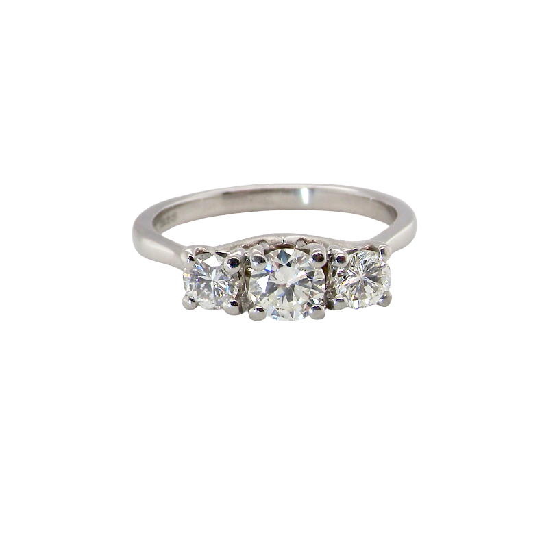 An exceptional three stone diamond trilogy ring, beautifully crafted in platinum and set with three modern brilliant cut white diamonds.