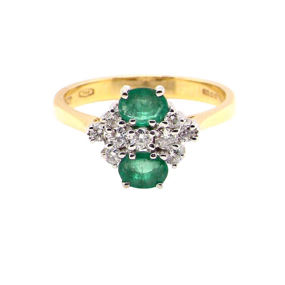 An exquisite Emerald and Diamond cluster ring