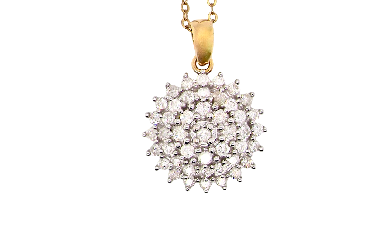 An impressive diamond pendant, set with multiple round brilliant-cut diamonds,