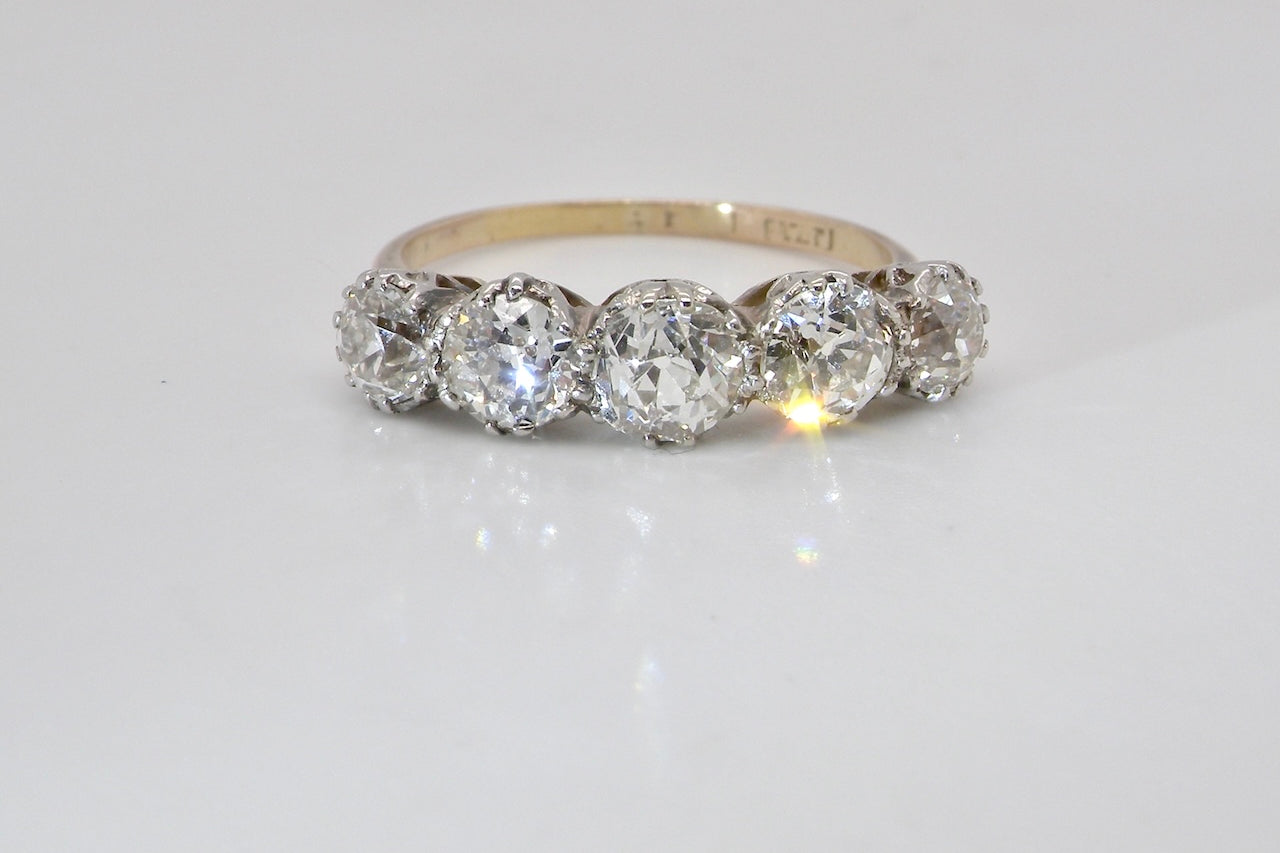 An impressive early 20th-century ring set with five white diamonds.