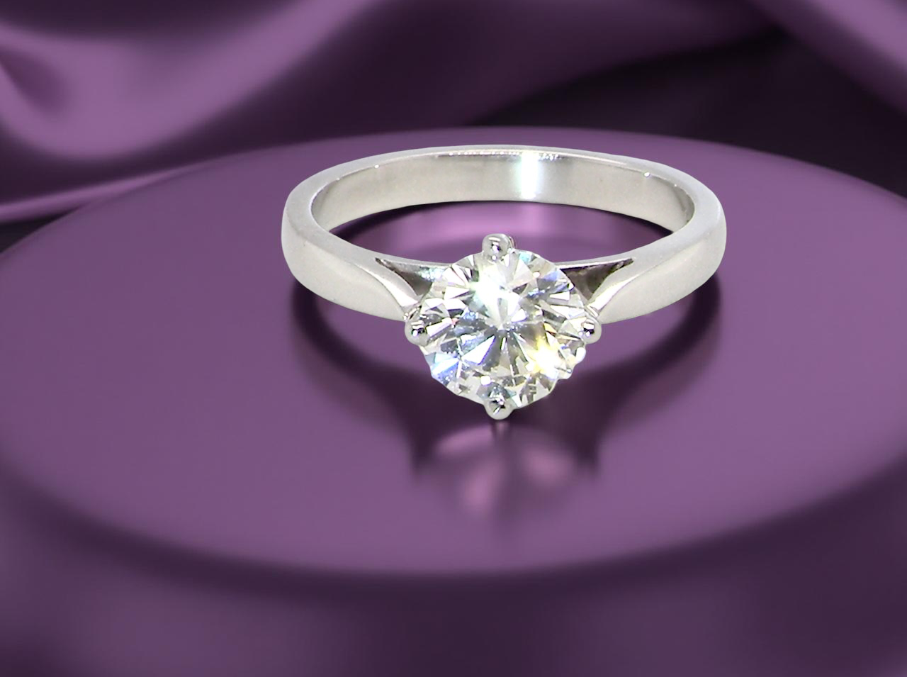 An impressive platinum solitaire ring set with a modern brilliant-cut white diamond. B