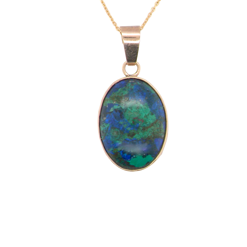 An interesting pendant set with an azurmalachite semi precious gem stone. Measures 20x15mm. Gold rim edged setting, with a V shaped bale. (tests as 9 carat gold) 