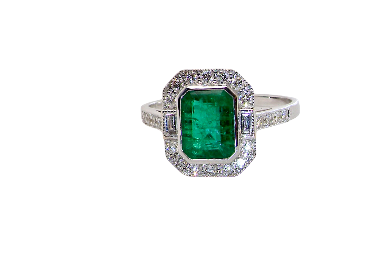 An Emerald and Diamond Cluster Ring – 18 carat White Gold