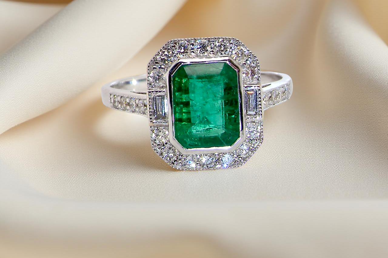 An emerald cluster ring