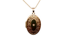 Gold locket with decorative design on a white background