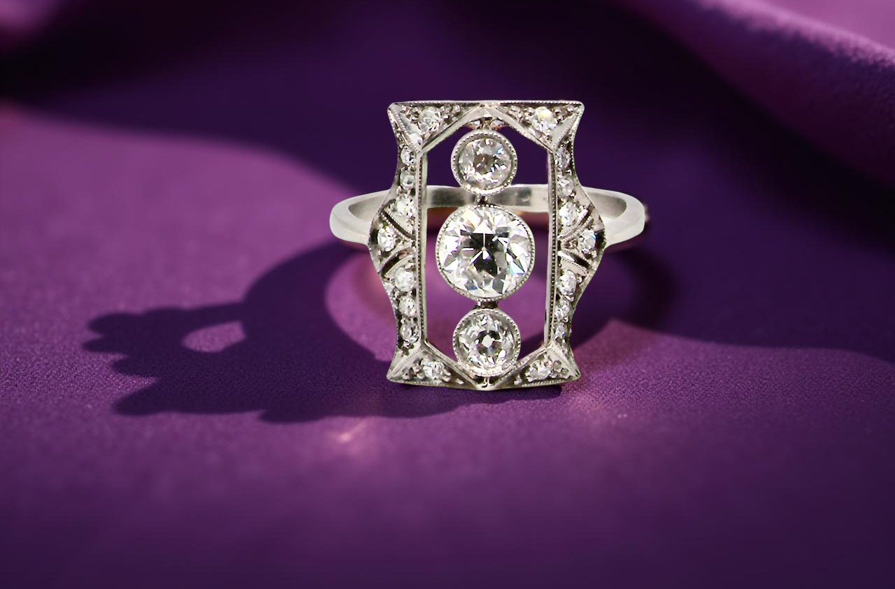 Diamond ring on a purple fabric background