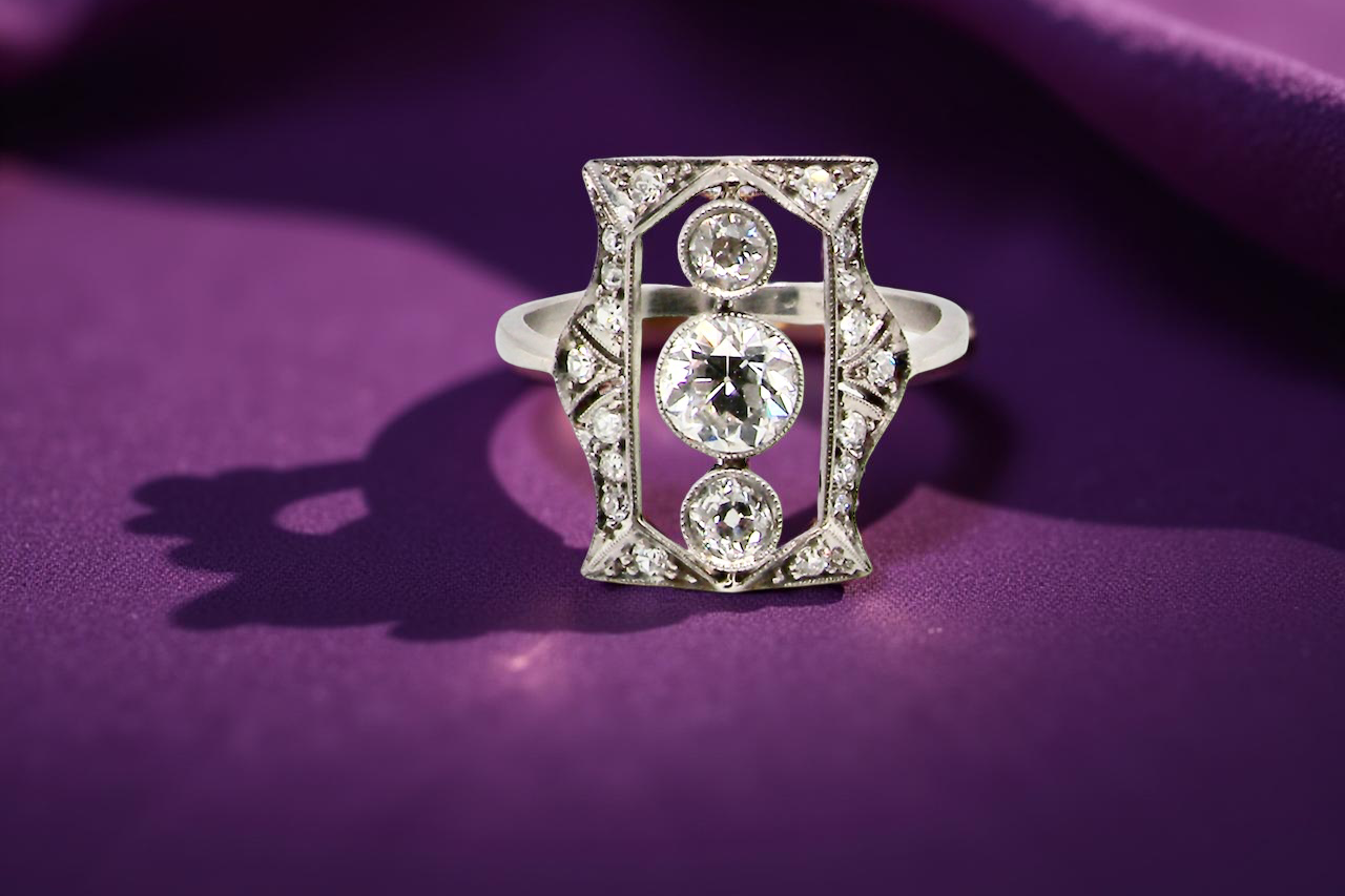 Diamond ring on a purple fabric background