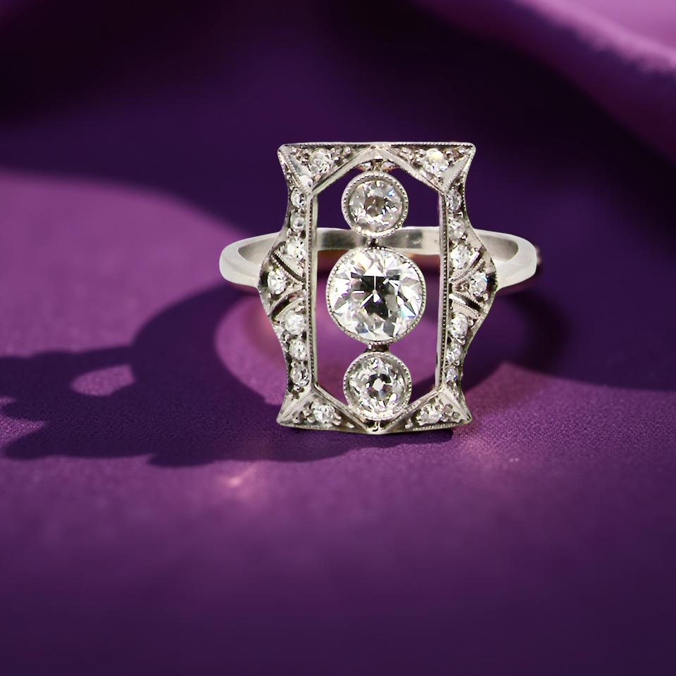 Diamond ring on a purple fabric background