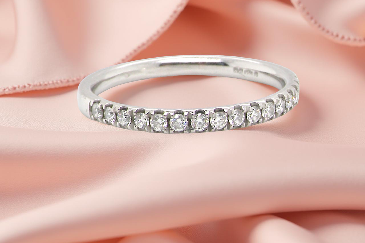 A Platinum Half Hoop Diamond Ring