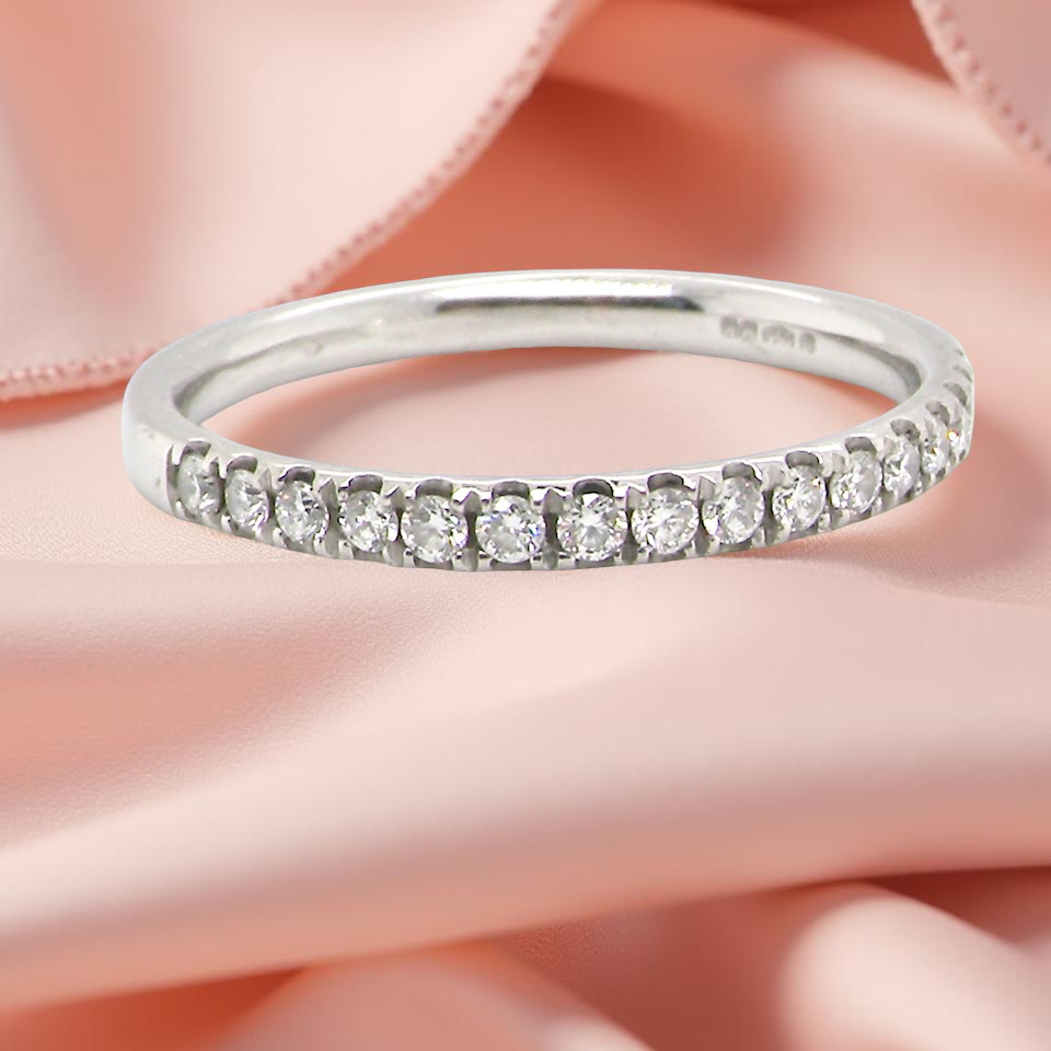 A Platinum Half Hoop Diamond Ring