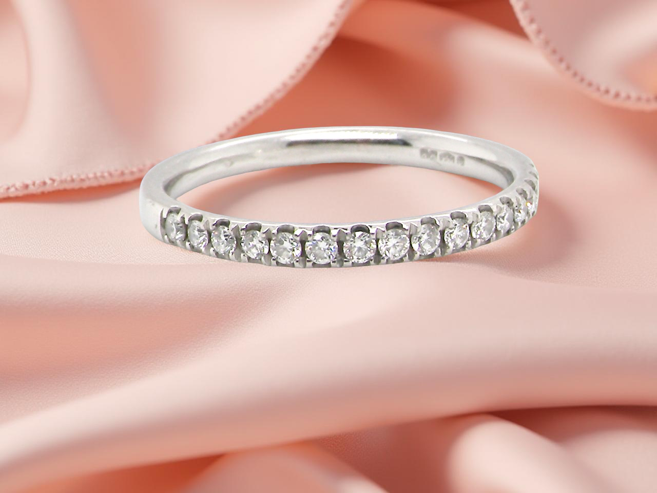 A Platinum Half Hoop Diamond Ring