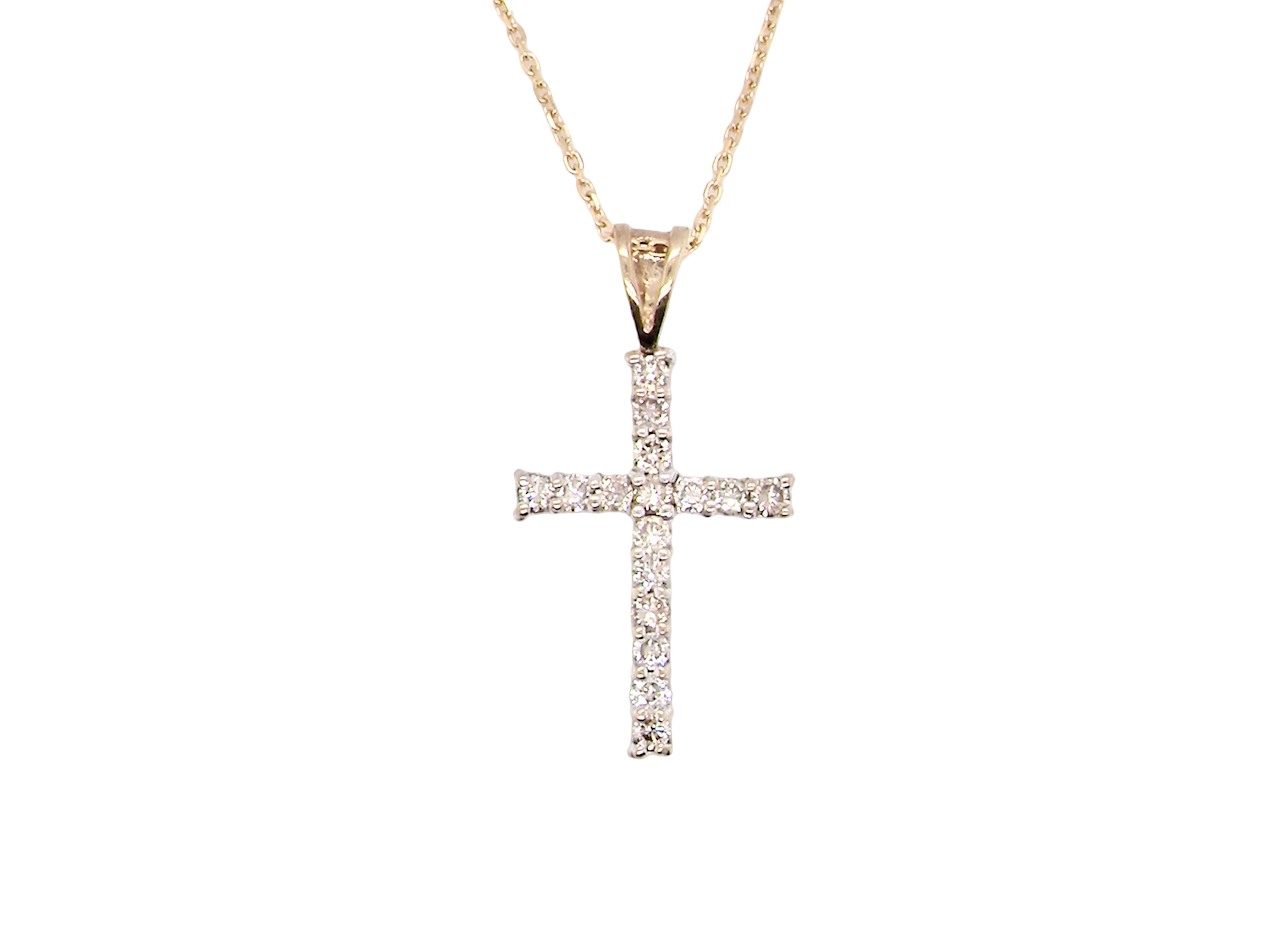 A 9 carat gold cross pendant. Set with fifteen small brilliant cut white diamonds.
Each 1.6mm, total carat weight estimated at 0.30 carats. Colour i-k, clarity Si. Overall size 18x12.5mm. Attached to an 18' neck chain.