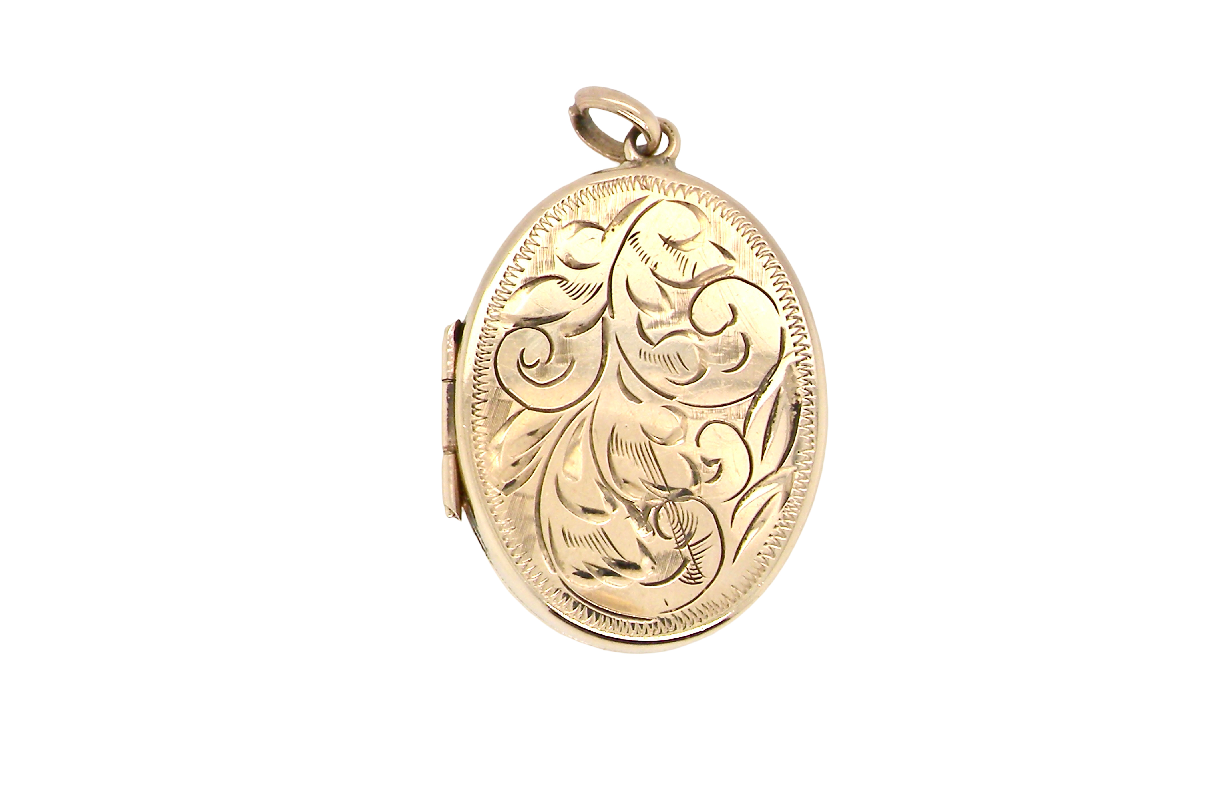 A large oval shaped locket. Measures 30x20mm. The front is hand engraved, reverse is plain.