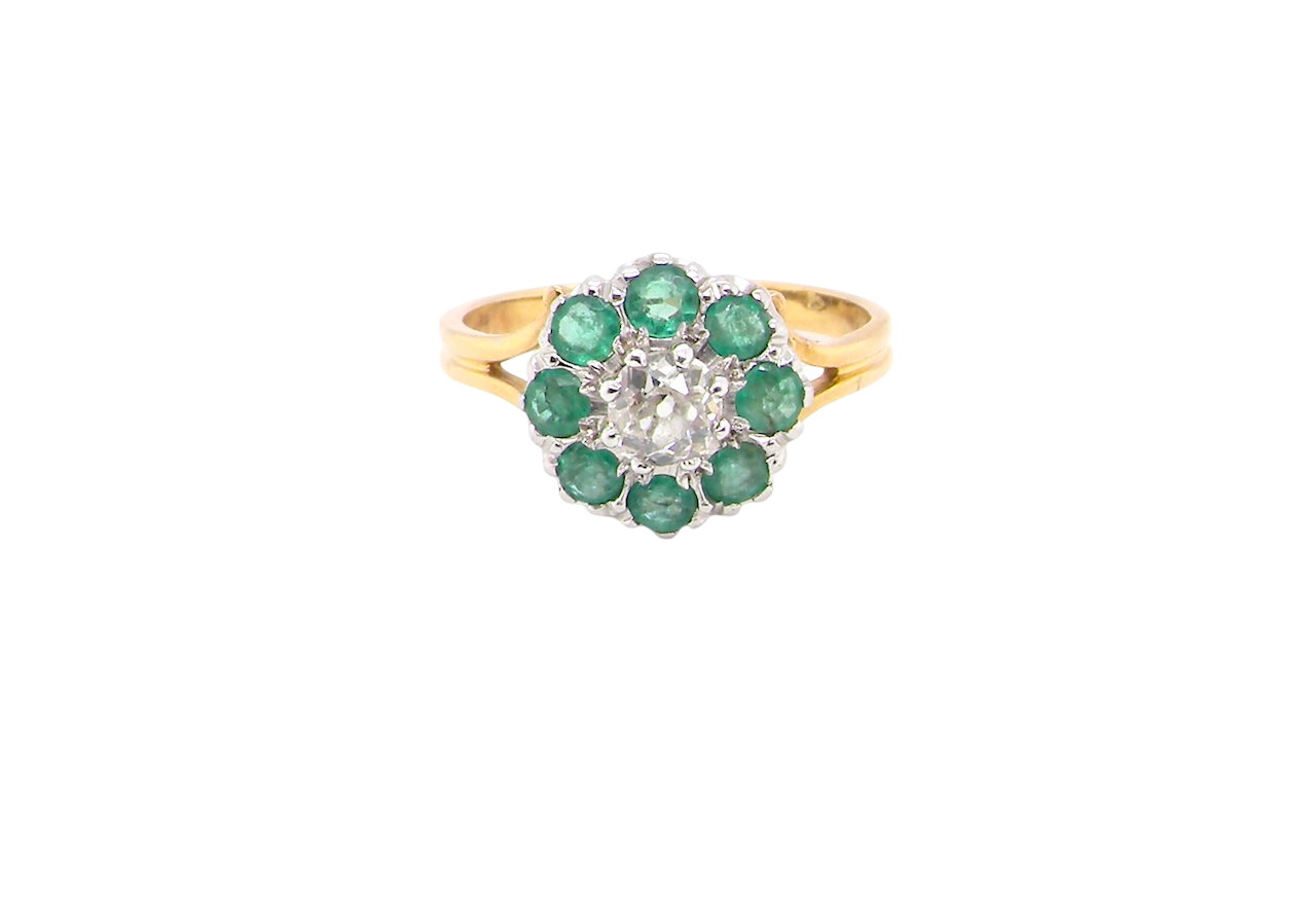 A vintage 1960s cluster ring. Principal stone a brilliant cut white diamond, 0.45 carats (5mm diameter) 