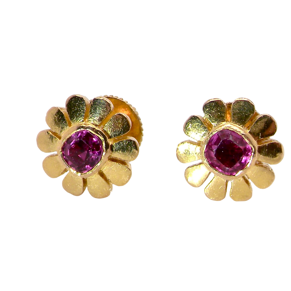 An exceptional pair of ruby earrings.Each earring is centred with a cushion-shaped ruby measuring approximately 3.6–3.8mm,