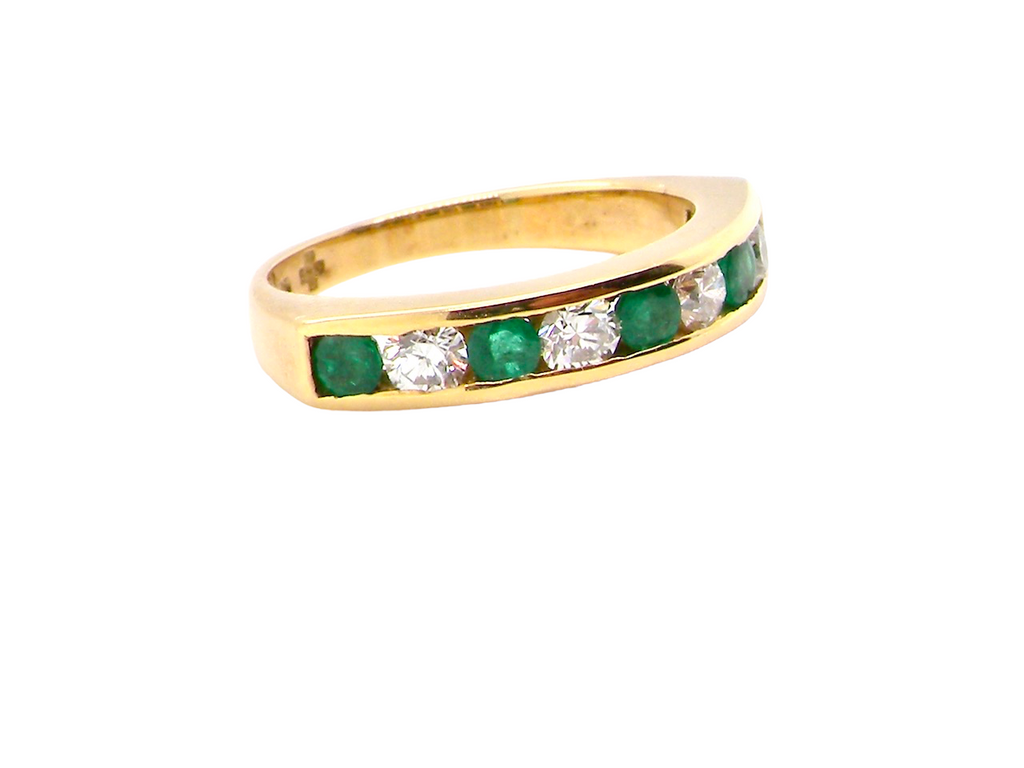 18 carat emerald and diamond eternity ring