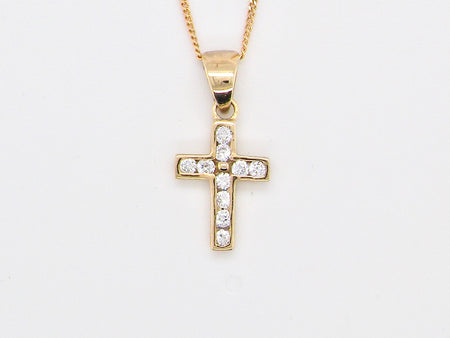 A 9 carat gold cubic zirconia cross